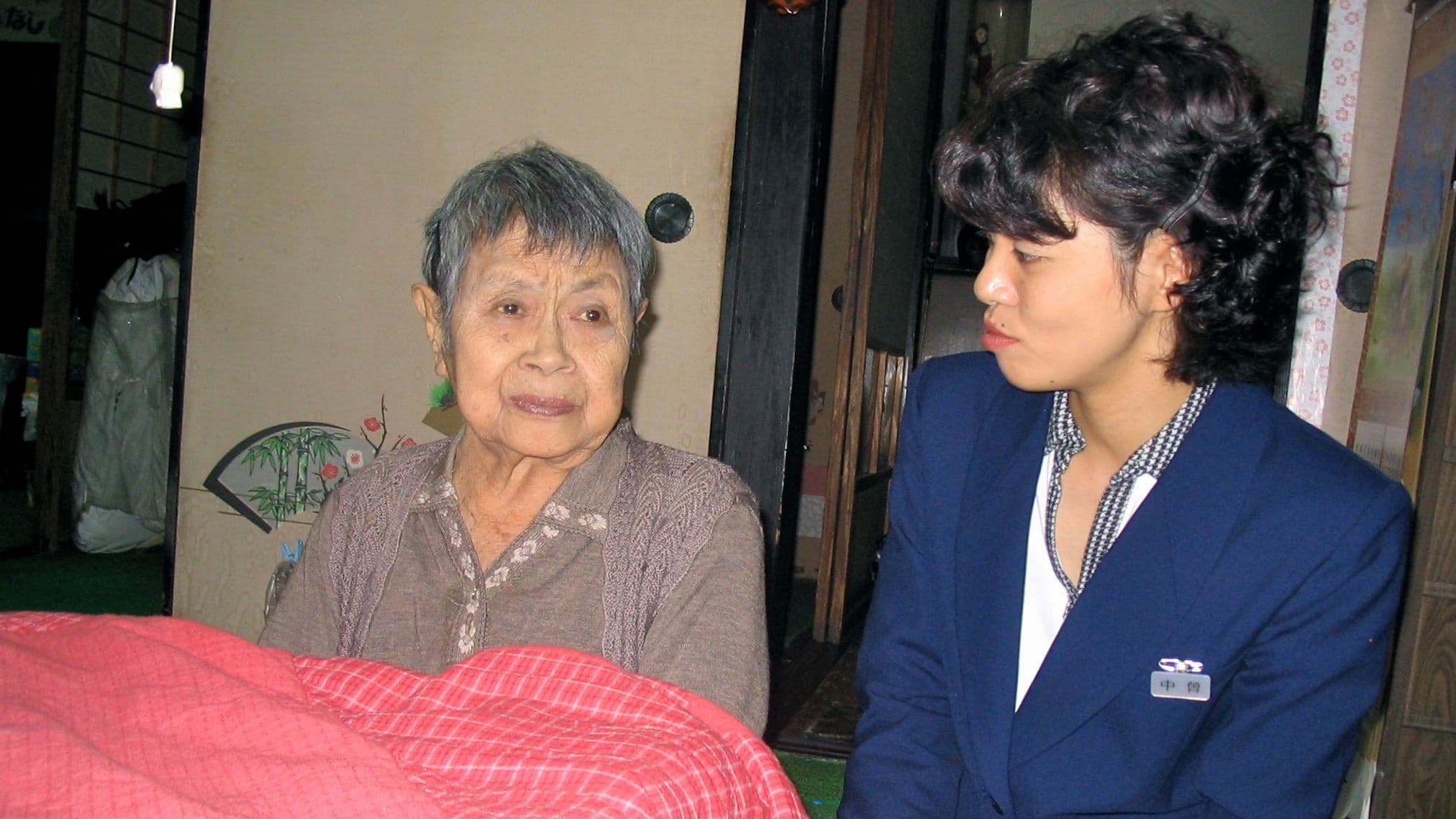 Social worker Minori Nakaso pays a home visit to an atomic bomb survivor in Hiroshima.