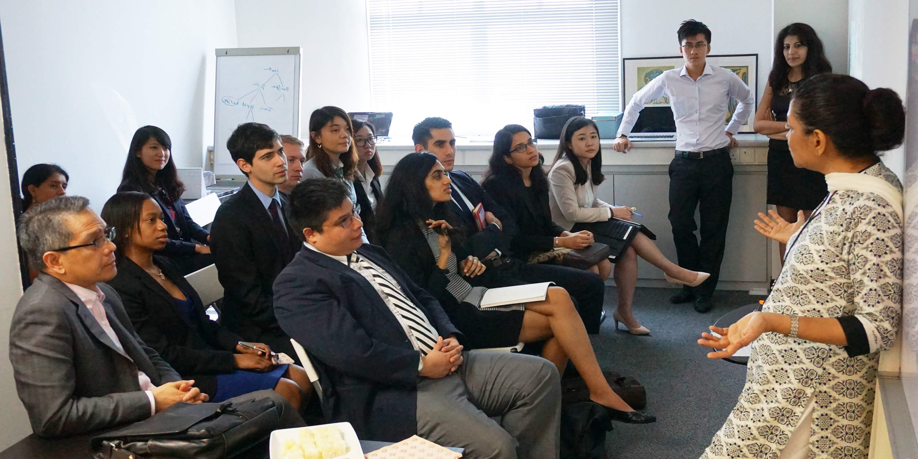 A group meets at IIX Impact Institute