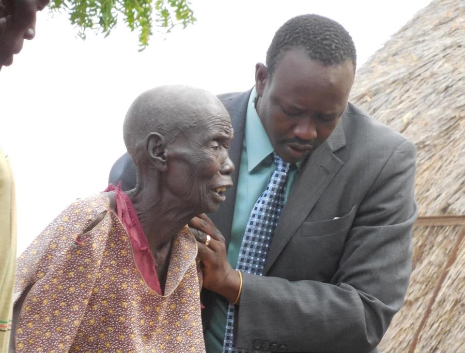 Jacob Atem in 2012 with his step-mother in the village of Maar, South Sudan.