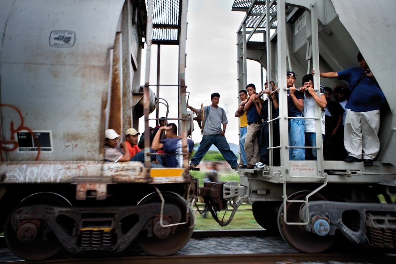 Migrants, mostly from Central America, take trains nicknamed "The Beast" through Mexico to the US border.