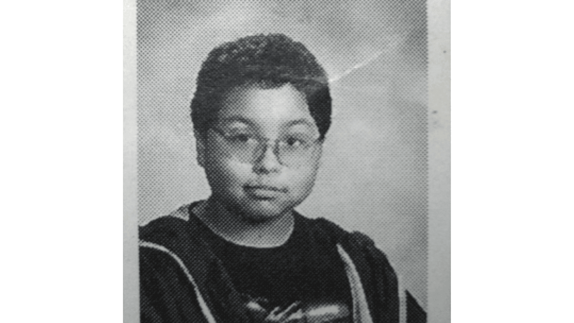 School portrait of young boy, black and white