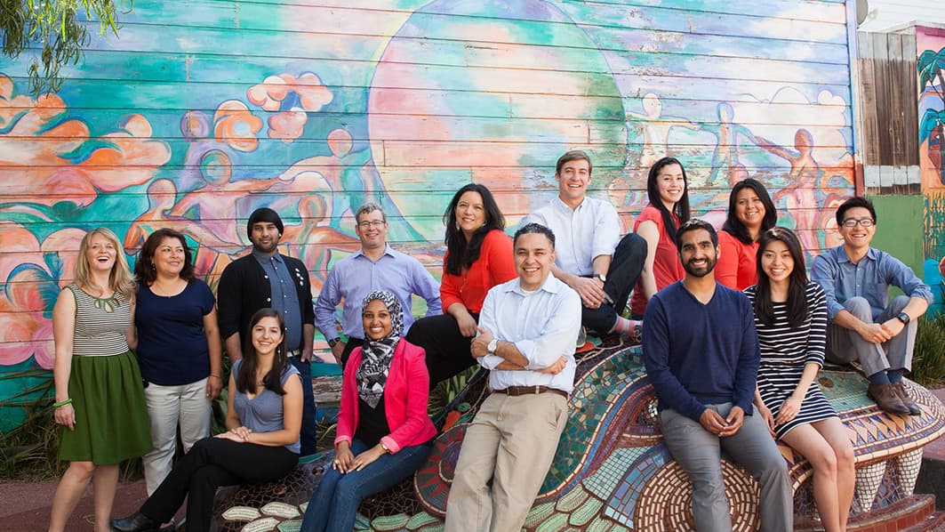 Jose Quinonez (center) and his staff at Mission Asset Fund in San Francisco