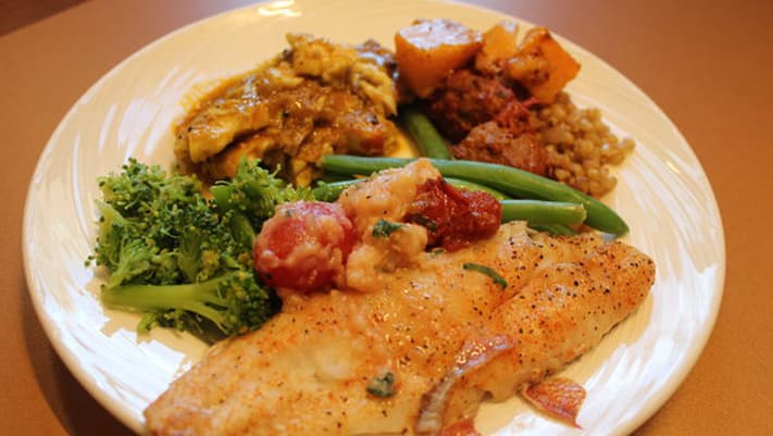 Bon Appétit's low-carbon food plan calls for putting vegetables at the center of the plate. Making the plate smaller cuts down on waste.