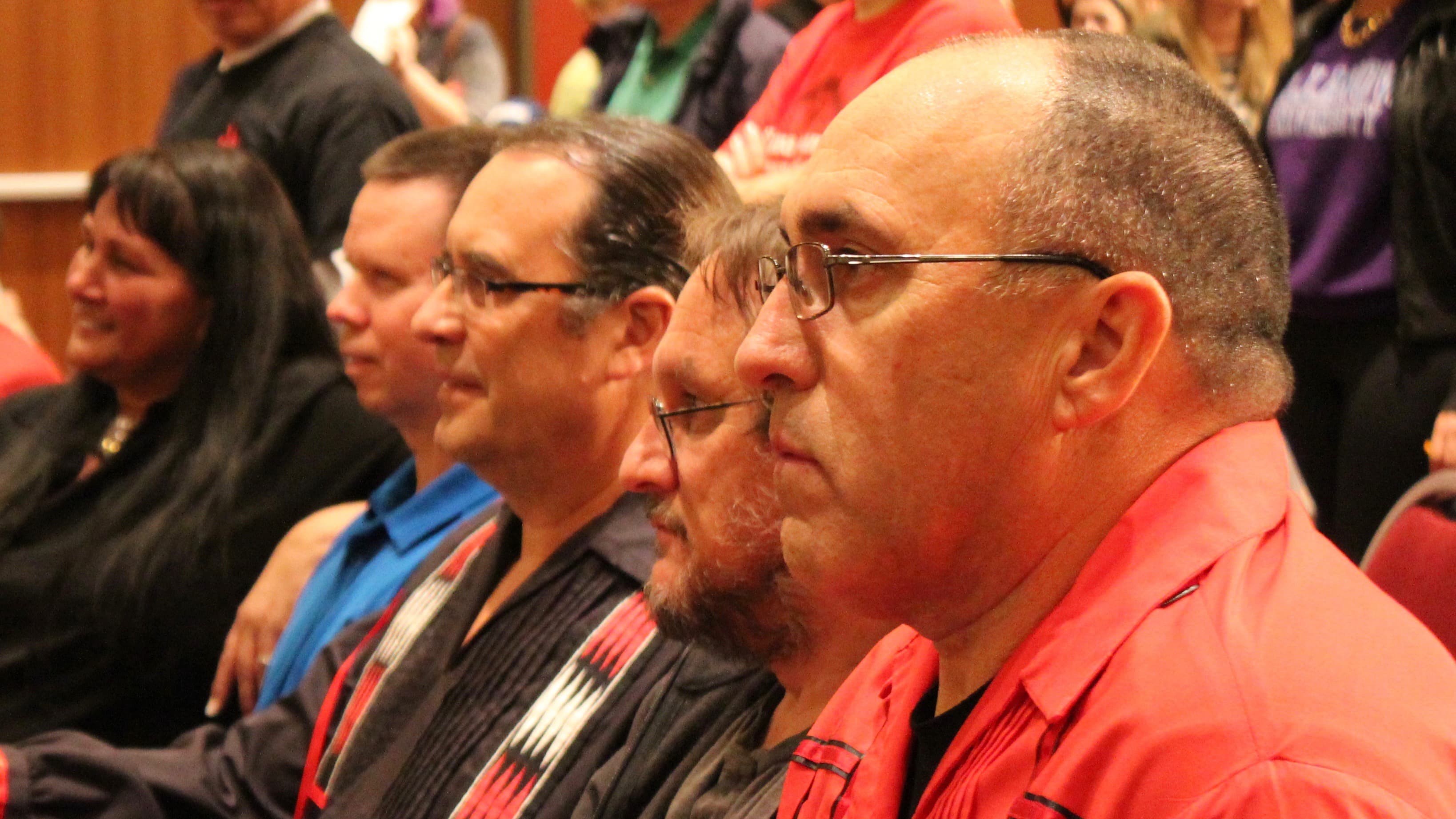 Myaamia Chief Doug Lankford (right), linguist David Costa (center), and Myaamia Center director Daryl Baldwin (left), watching a traditional Stomp Dance in Oxford, Ohio.