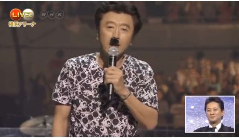 Keisuke Kuwata wears a fake Hitler mustache at the start of the 2014 Red and White Song Competition, a major New Year's Eve institution in Japan.