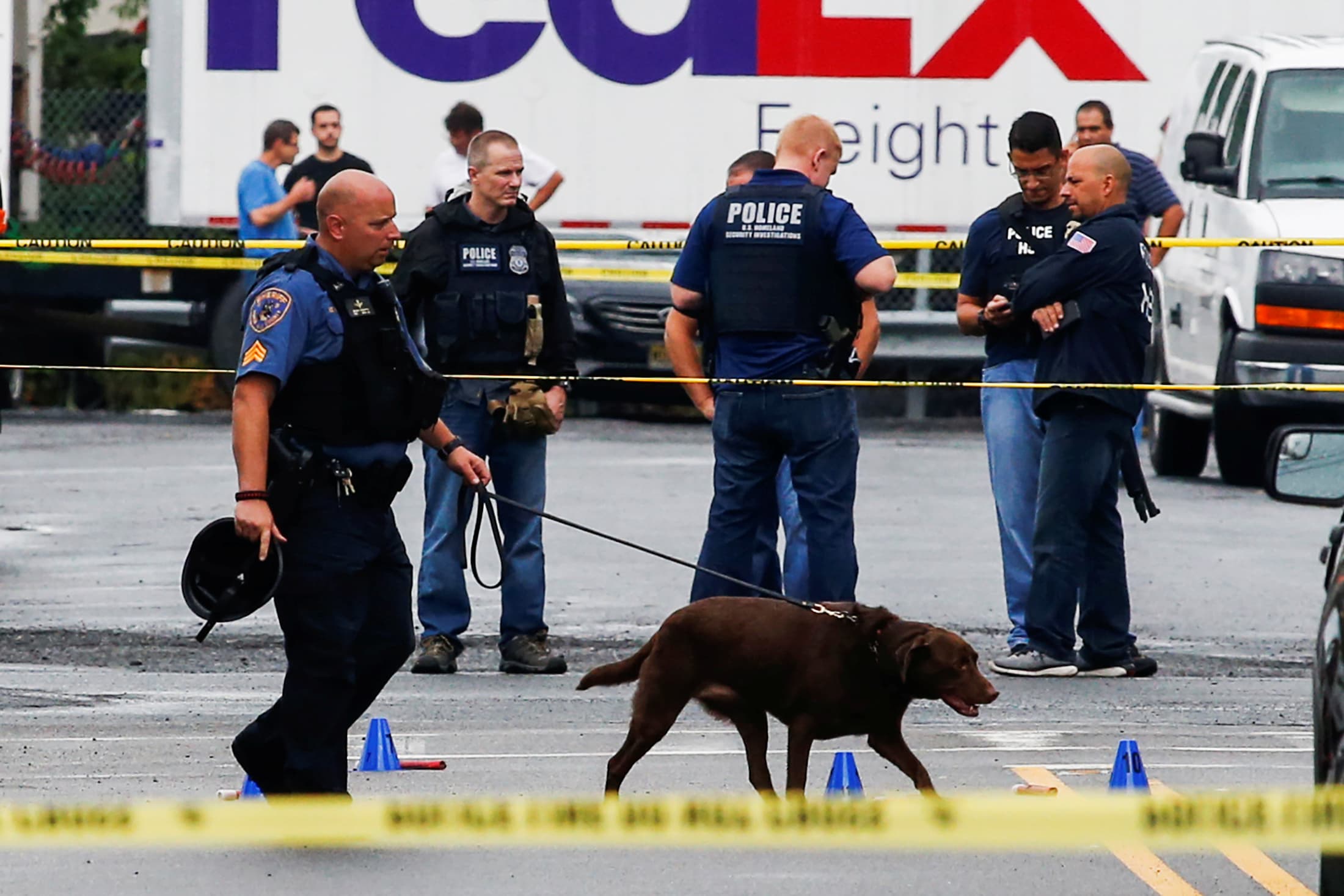 Law enforcement officers mark evidence near the site where Ahmad Khan Rahami was taken into custody