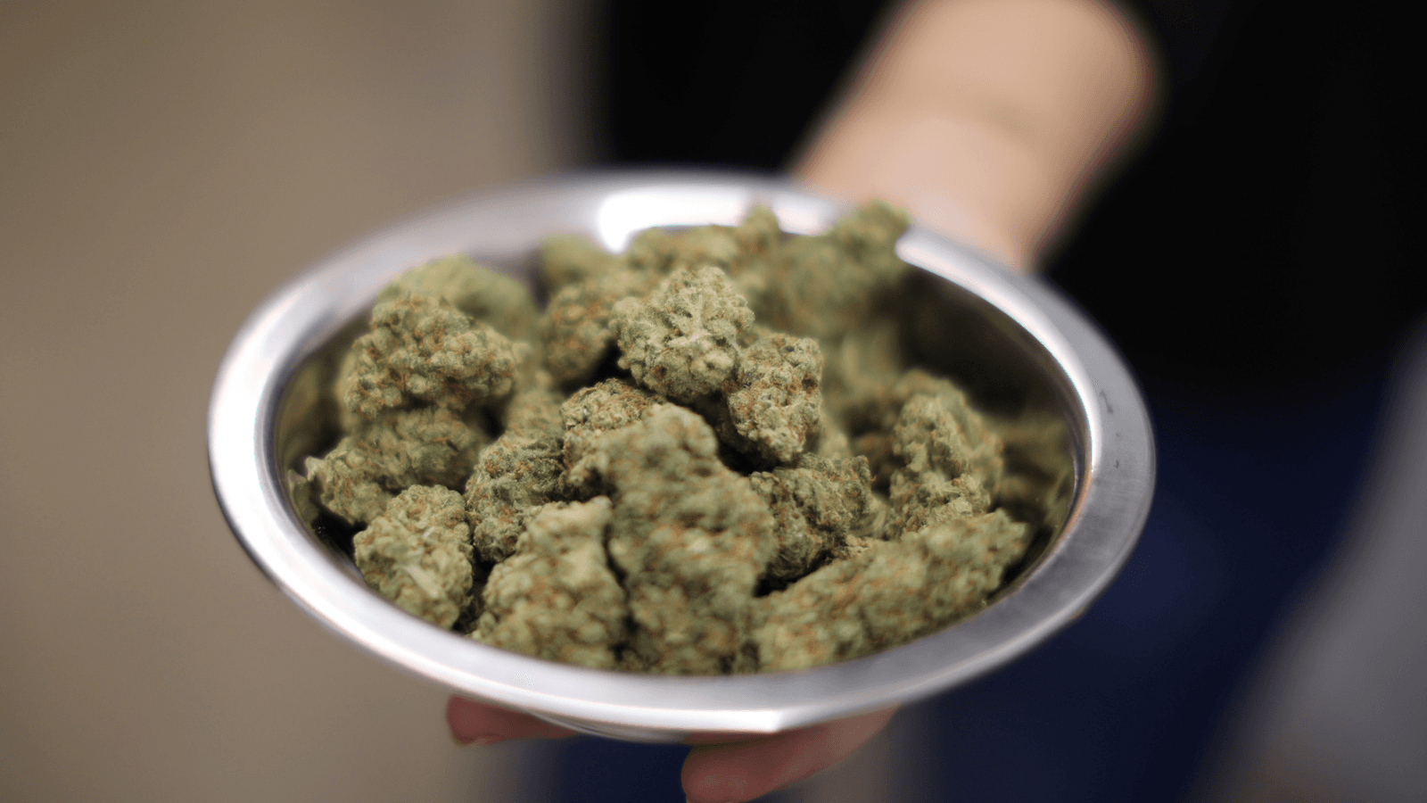 A woman holds marijuana for sale at the MedMen store in West Hollywood, California, Jan. 2, 2018.
