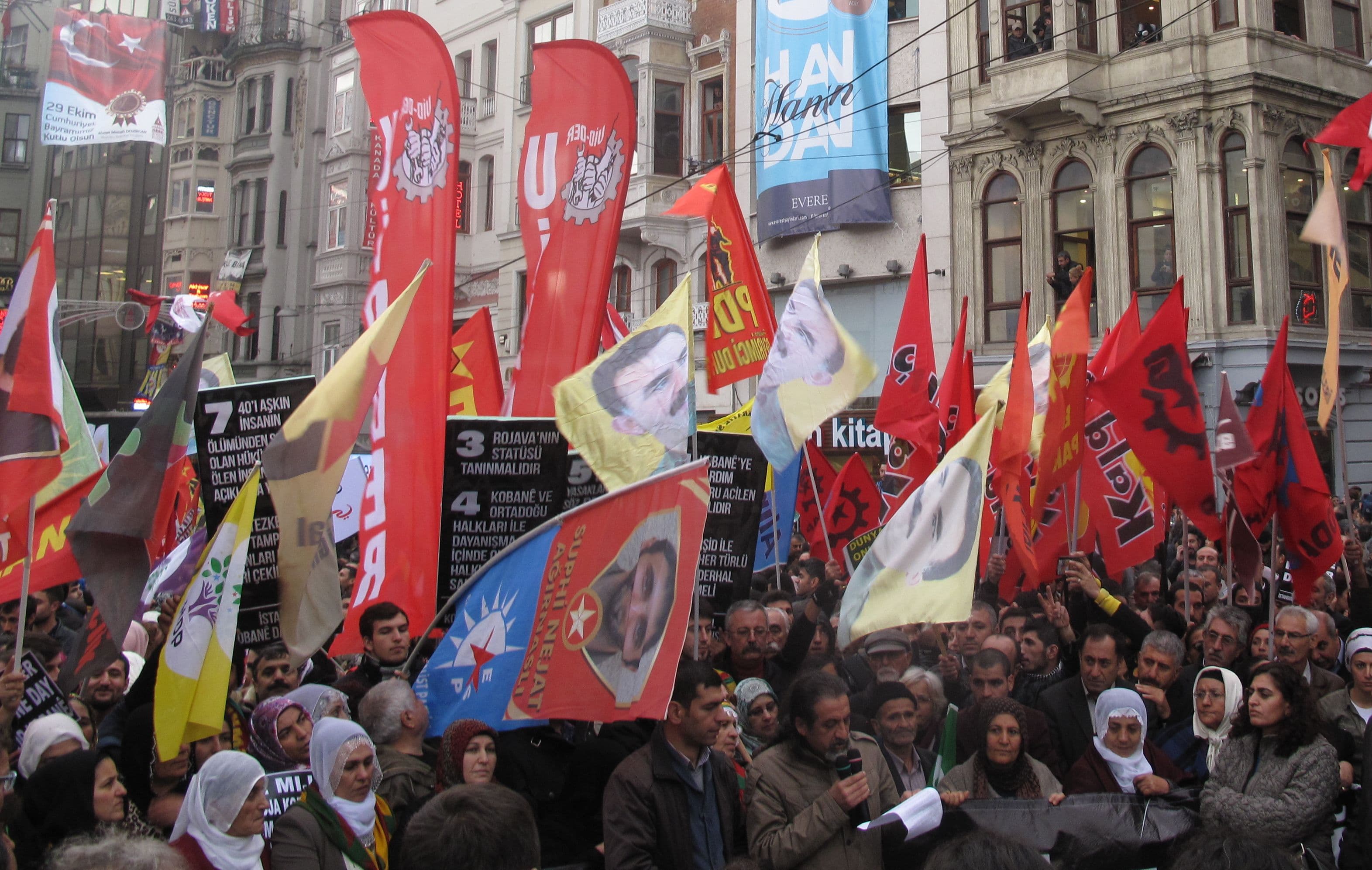 Doctor Samet Menguc, Secretary General of the Istanbul Chamber of Medicine, reads a press statement decrying the Turkish government's inaction over the plight of Kobane. About two thousand people marched in Istanbul - one of several rallies across the cou