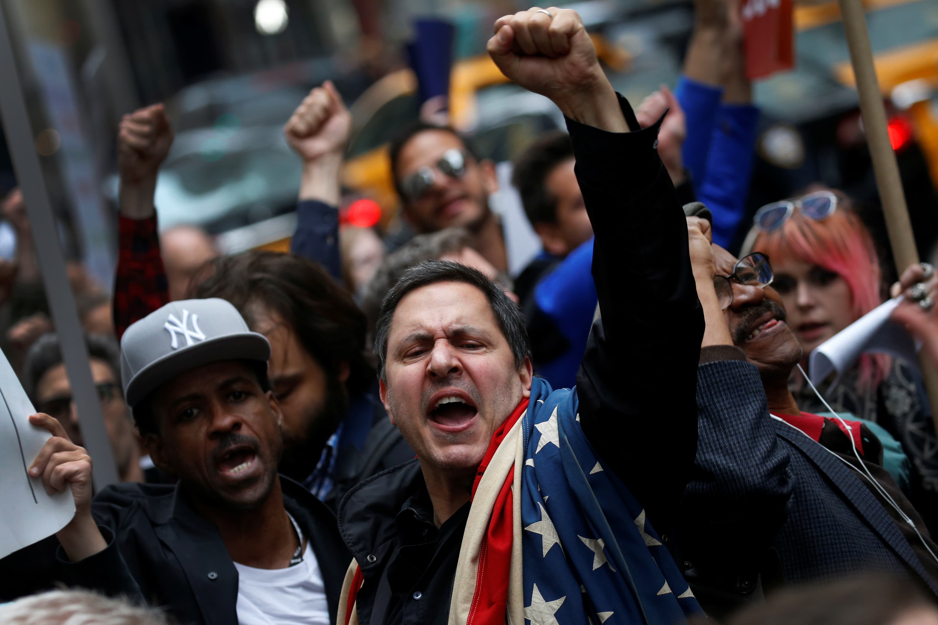 Protesters demonstrate near Trump Tower against President Donald Trump in the Manhattan borough of New York City, May 4, 2017.