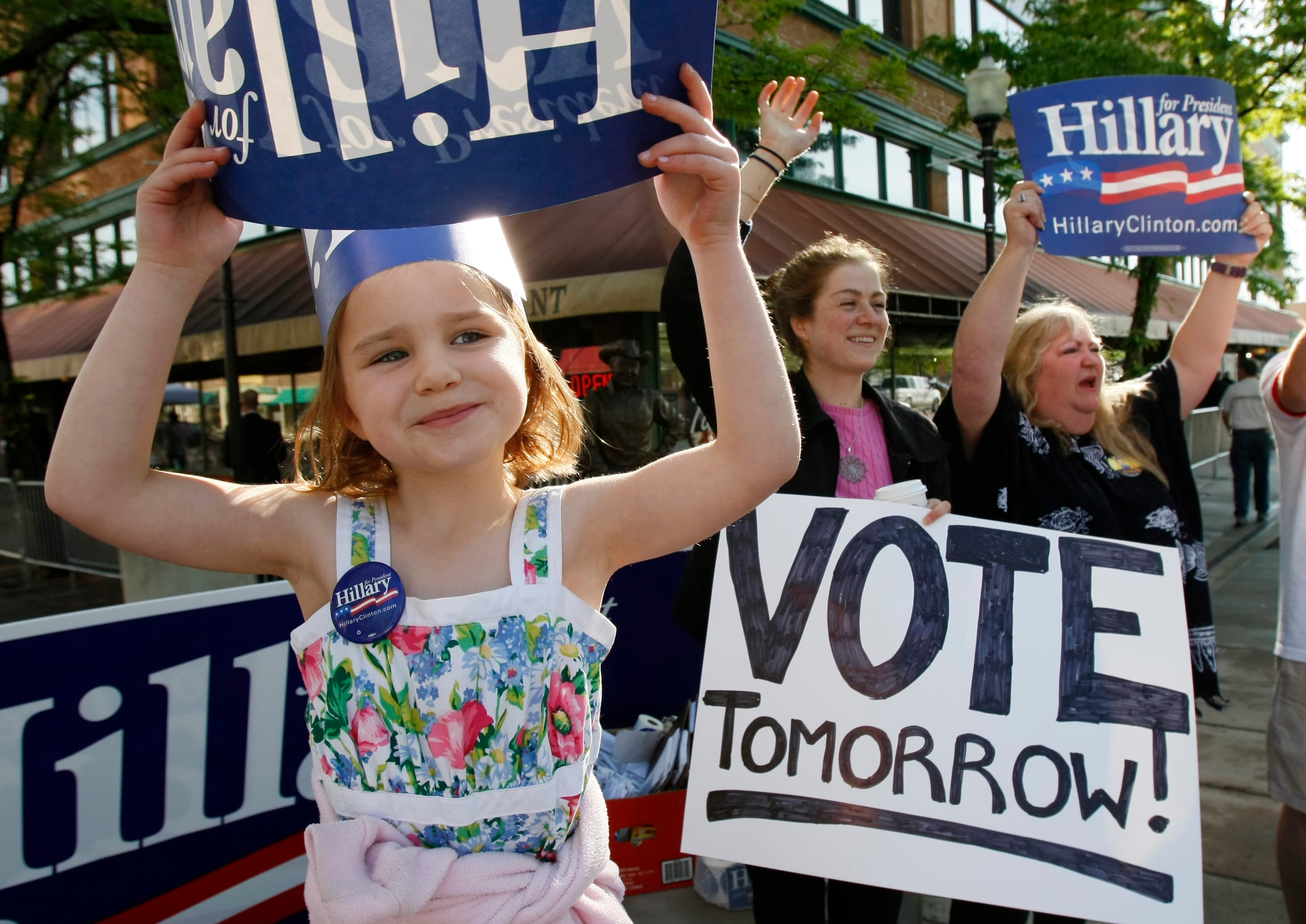 Four-year-old Lauren Lettner holds a sign