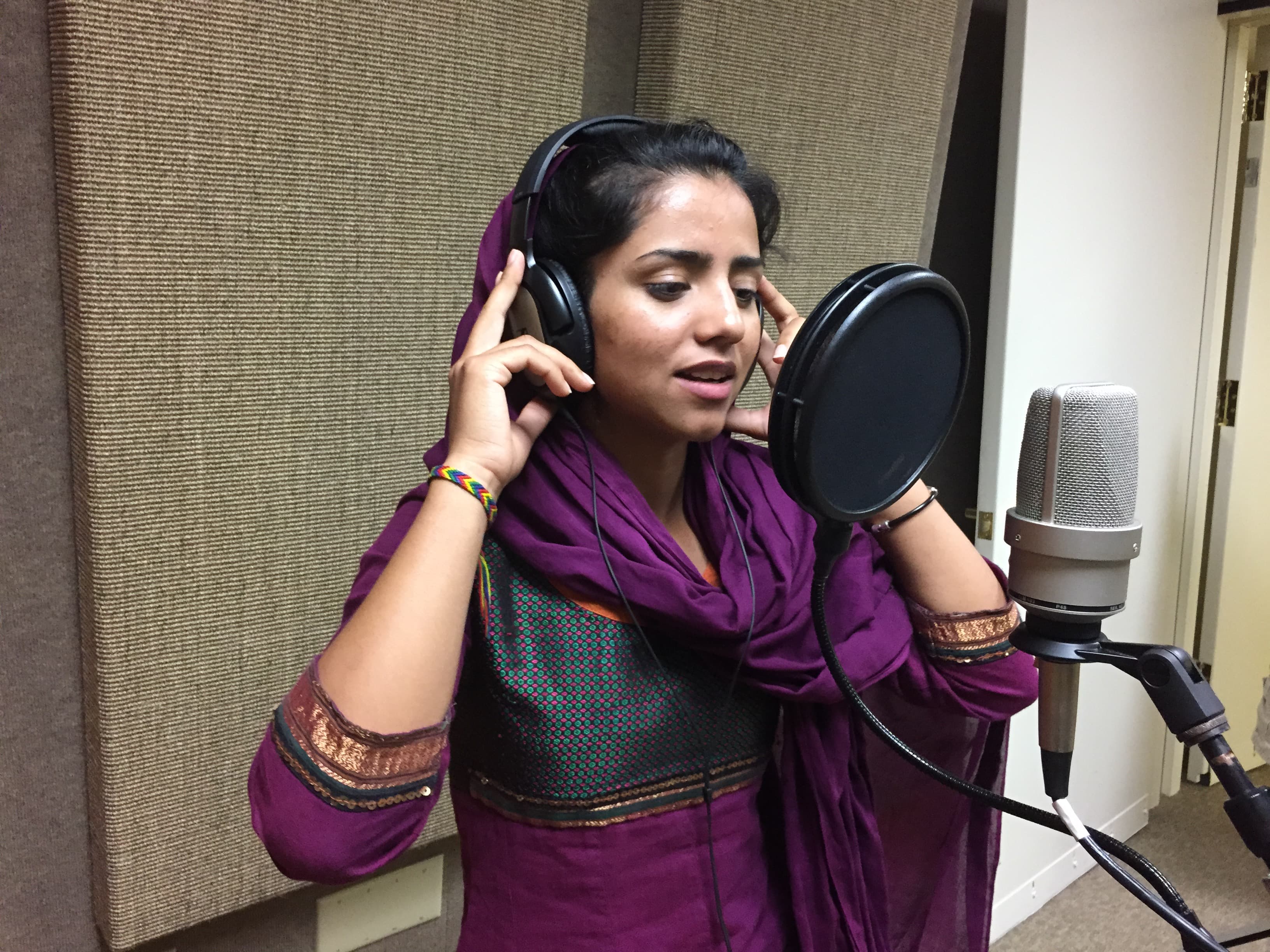 Sonita Alizadeh sings inside of the recording studio at her high school in Utah.