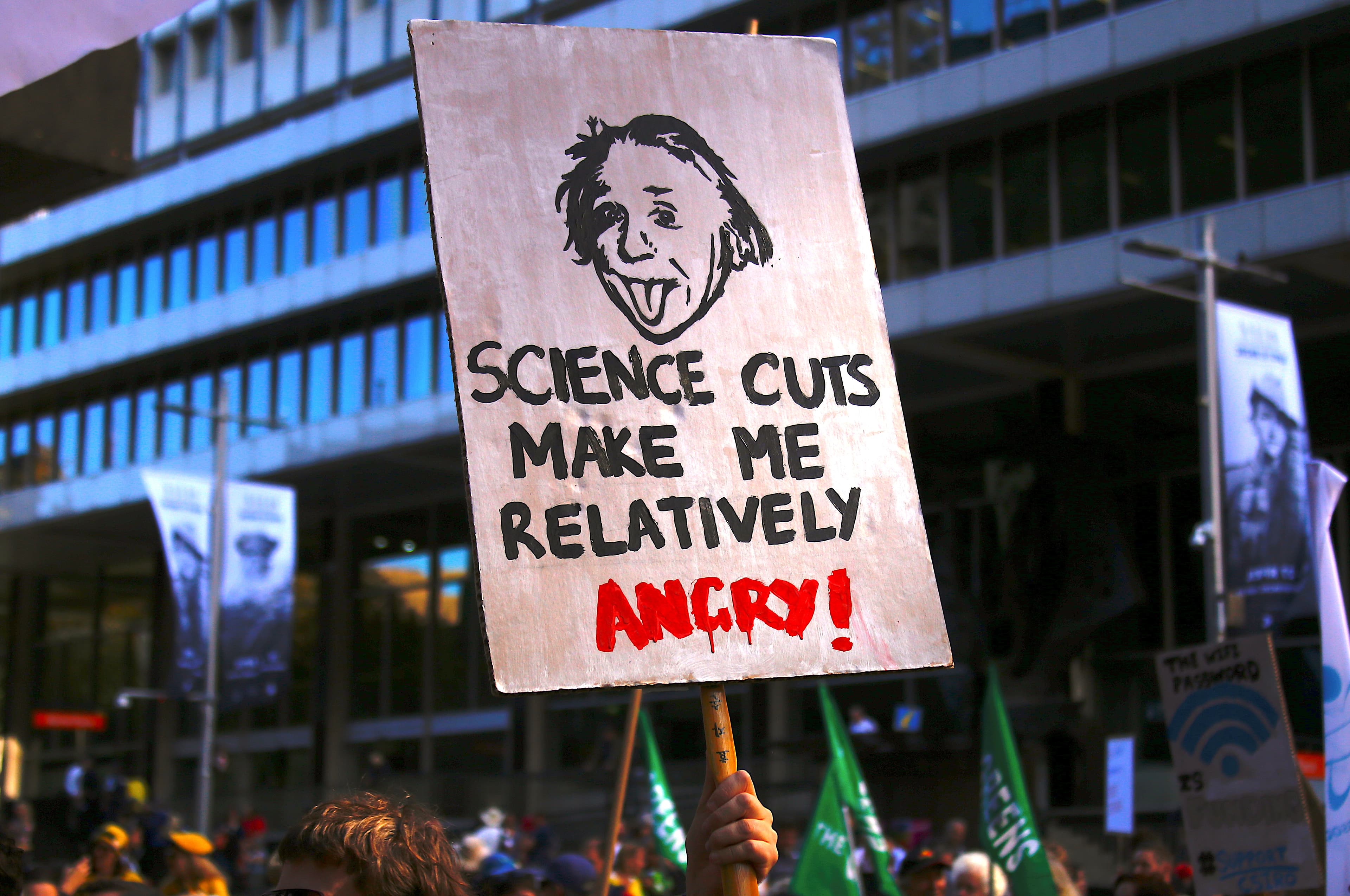 Protesters hold placards and banners as they participate in the March for Science rally on Earth Day, in central Sydney, Australia April 22, 2017.