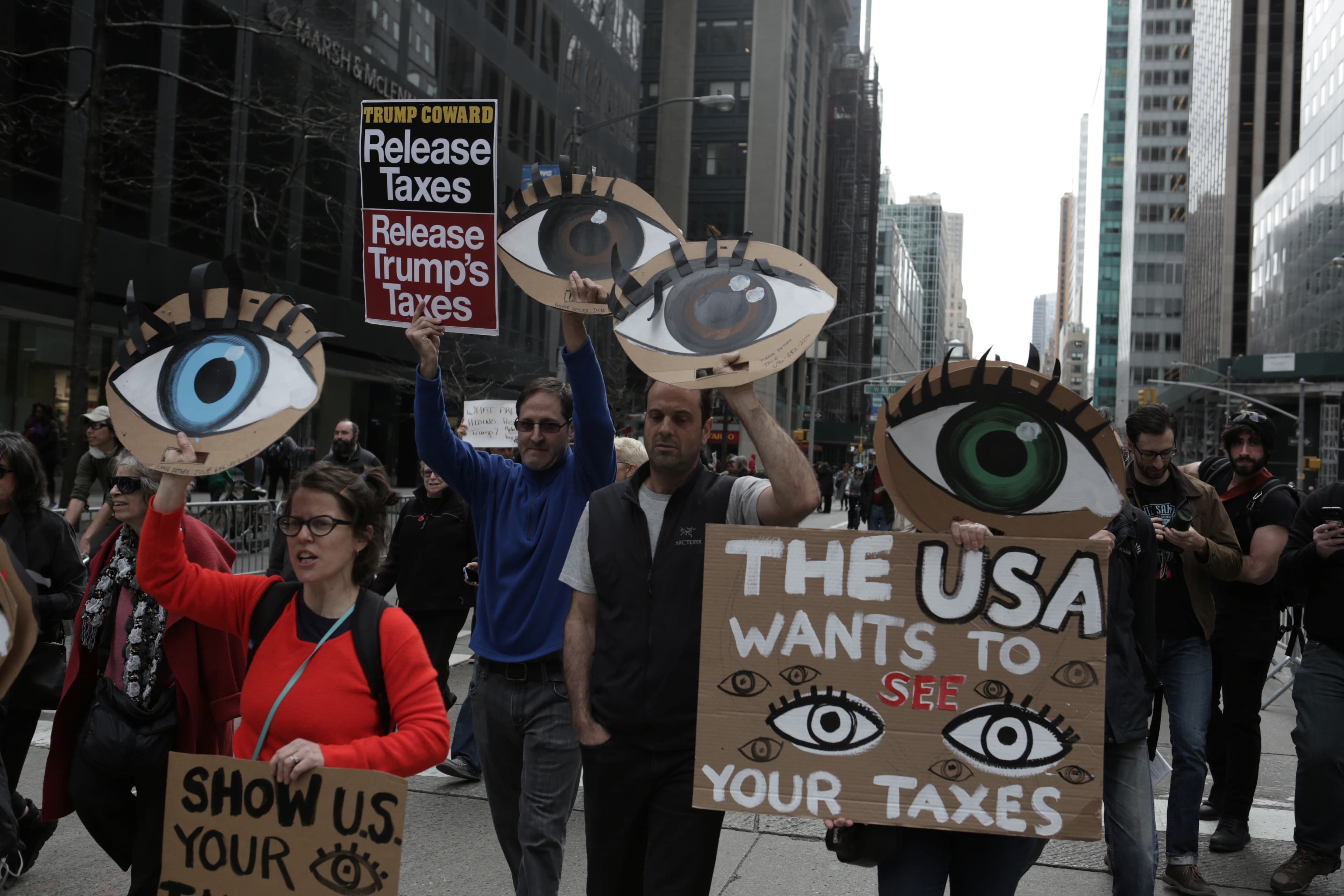 People march demanding U.S. President Donald Trump release his tax returns, in New York, April 15, 2017.