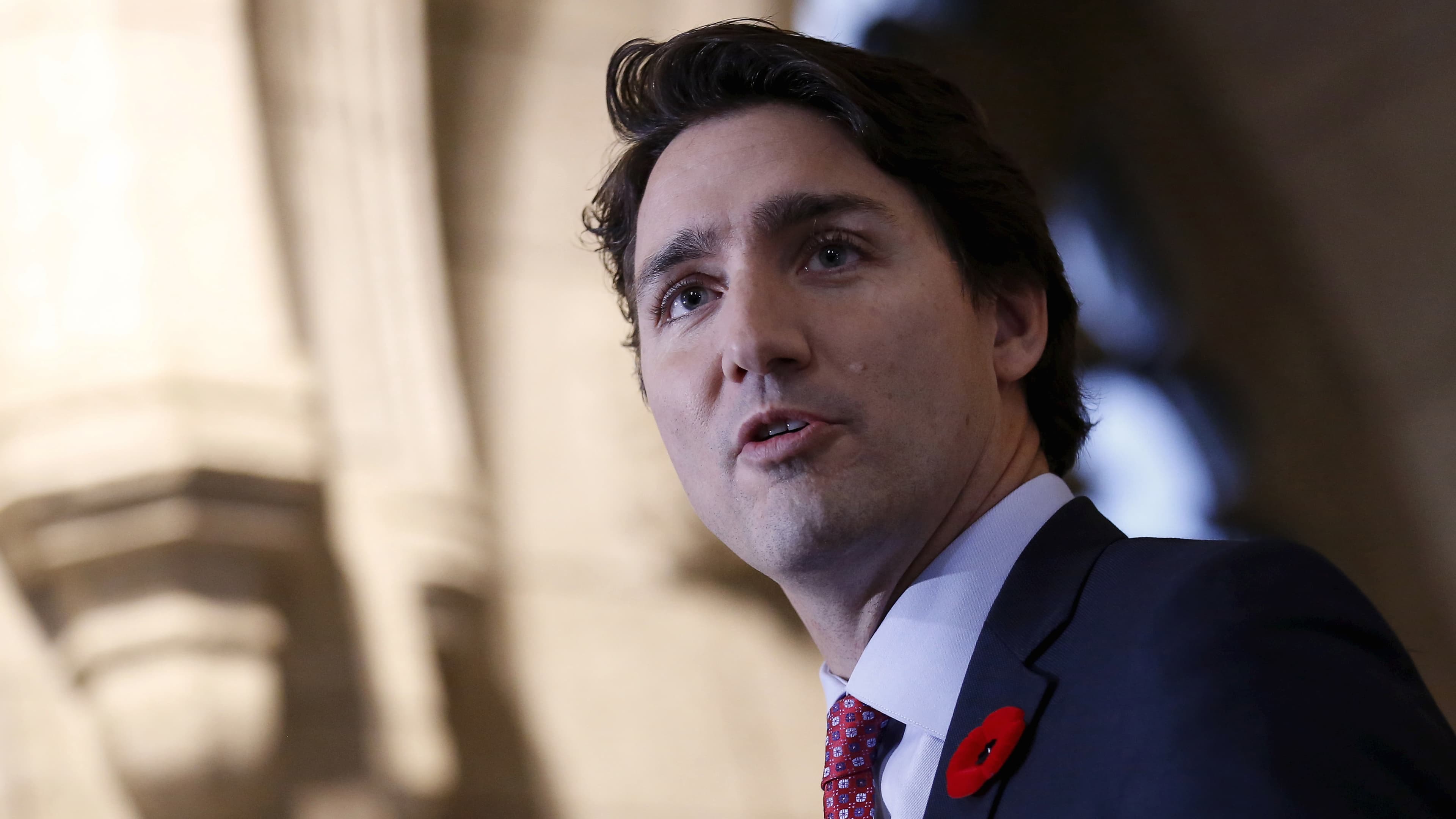 Canada's Prime Minister Justin Trudeau speaks to journalists as he arrives for a Liberal caucus meeting on Parliament Hill in Ottawa, Canada on November 5, 2015.