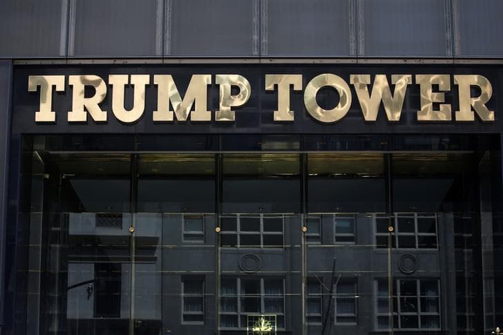 The logo of Trump Tower appears in big, bold, capitalized golden letters on one of Donald Trump's iconic buildings in New York City.