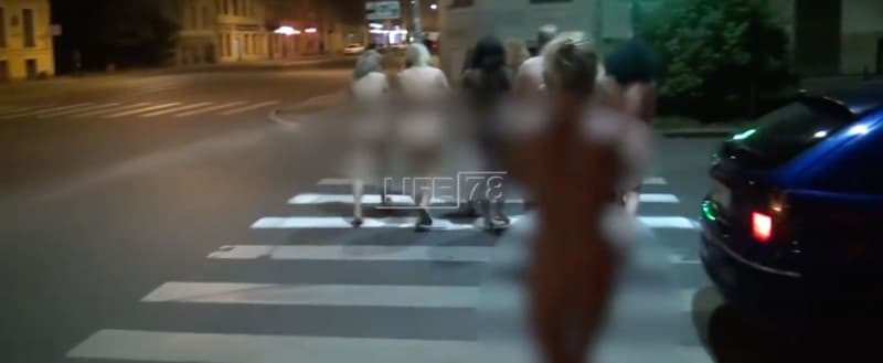Women forced to walk nude through the streets en route to a police station. “Activists” captured them for practicing prostitution.