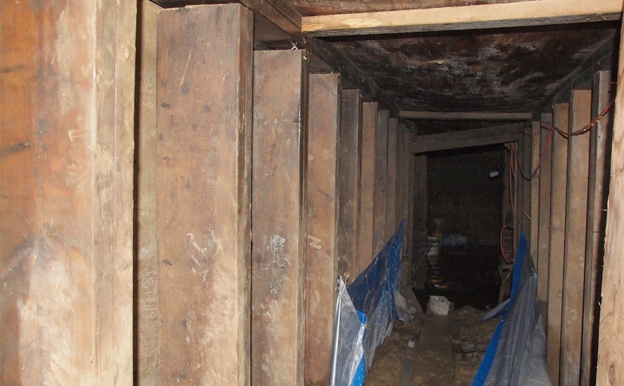 A 33-foot-long tunnel supported using lumber.