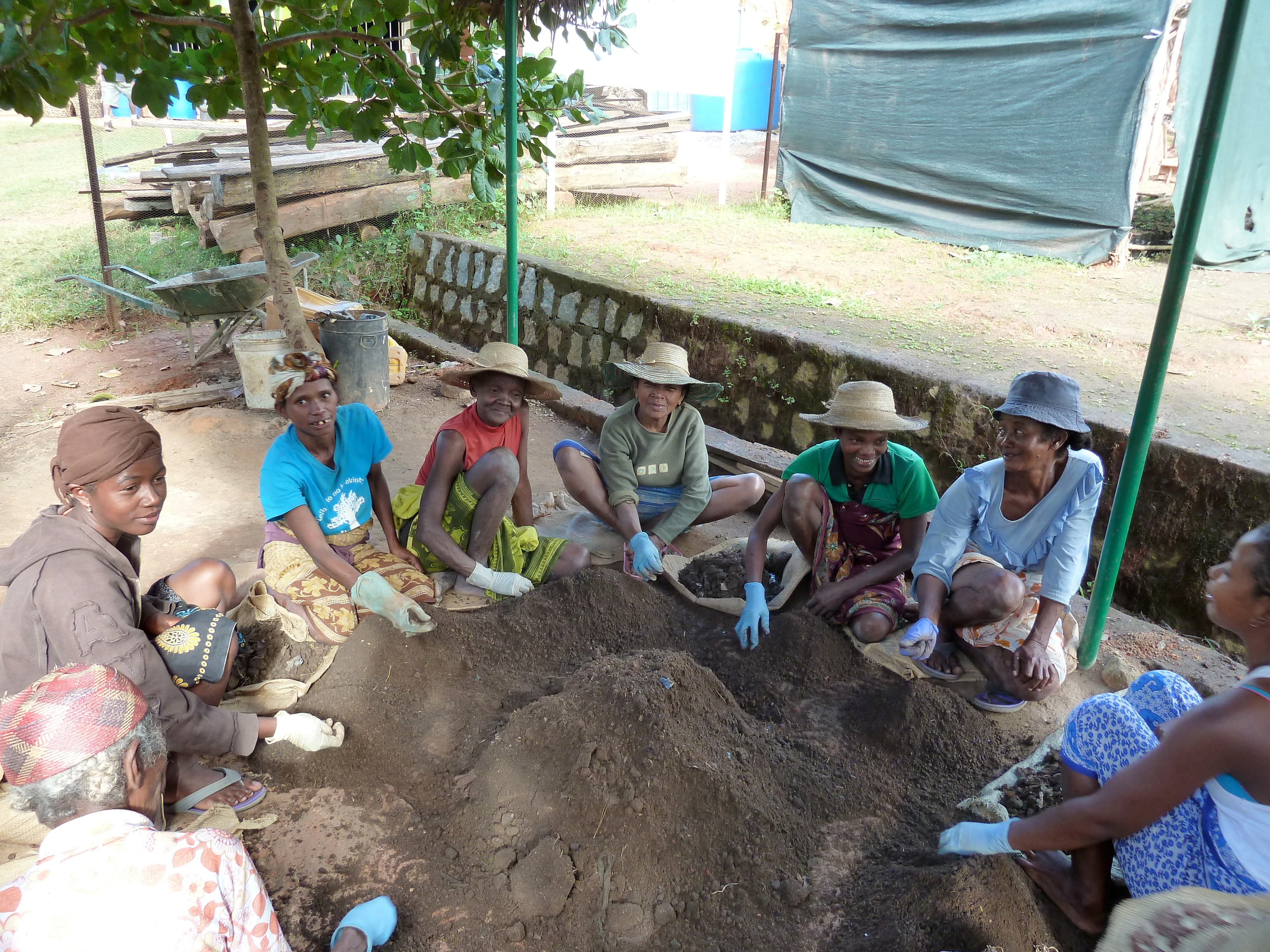 A group of local women sort compost for the reforestation project in the village of Kianjavato. Over the last five years the Madagascar Biodiversity Partnership has become the largest employer in the region.