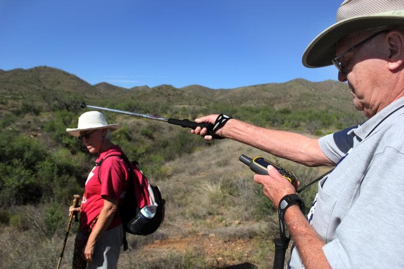 Artist Deborah McCollough and her husband, Ed, traversing the desert in southern Arizona with the Tucson Samaritans, a humanitarian group that helps undocumented migrants.