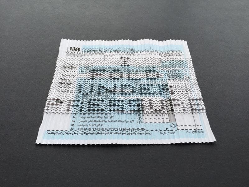 From Isabella Hander: ''I Fold Under Pressure', or, how an origamist does her taxes. No cutting, gluing, or the like was involved in the folding process.'