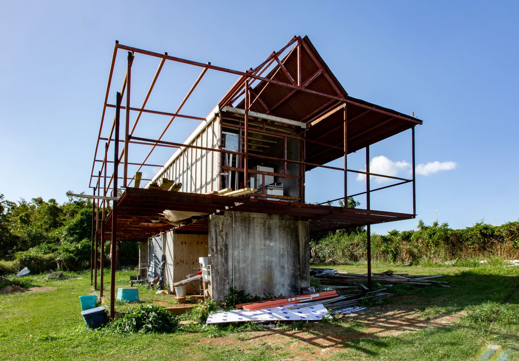 A cement structure is shown with a metal bar framing around it.