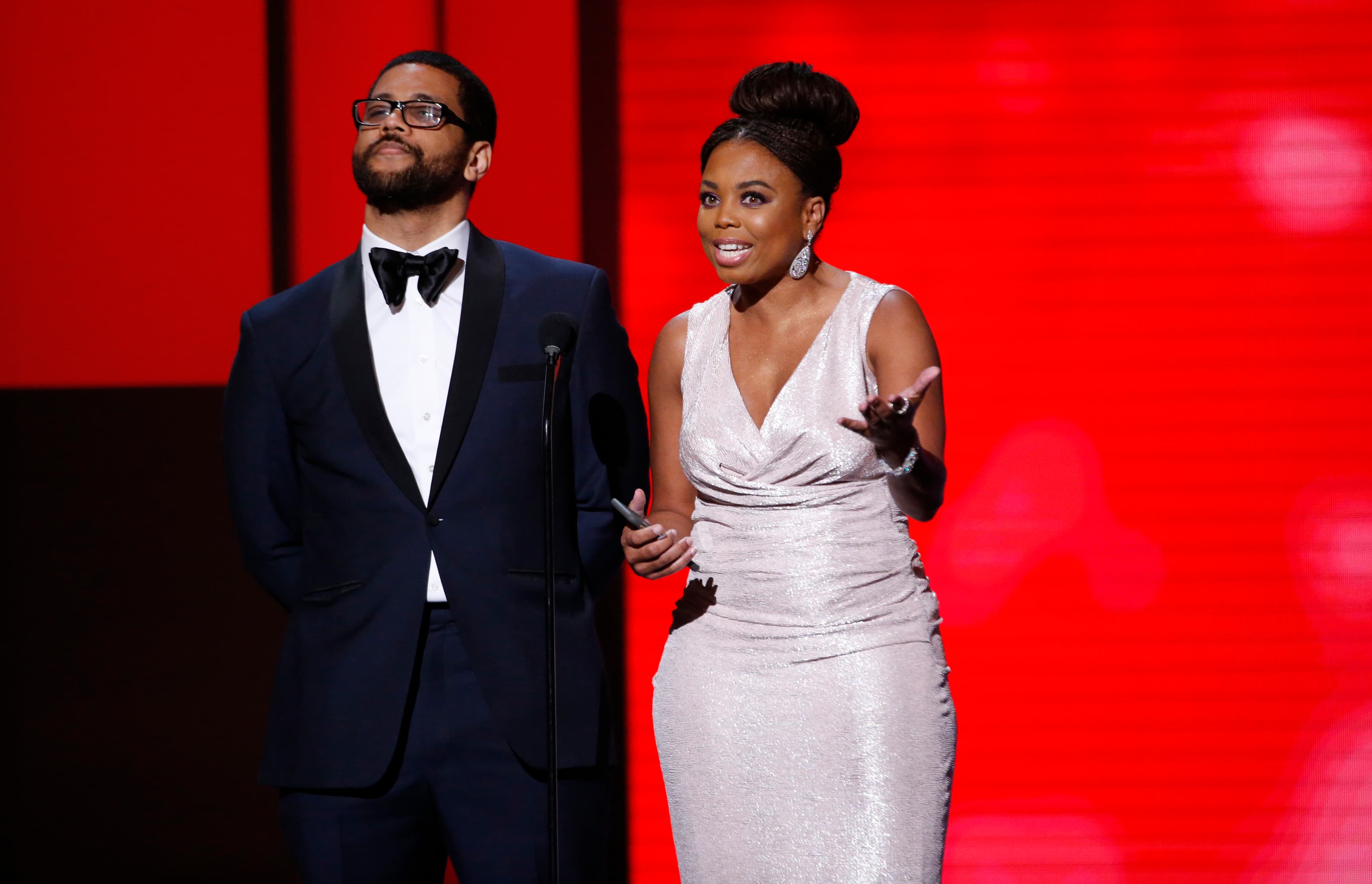 Presenters Jemele Hill and Michael Smith speak on stage at 49th NAACP Image Awards.