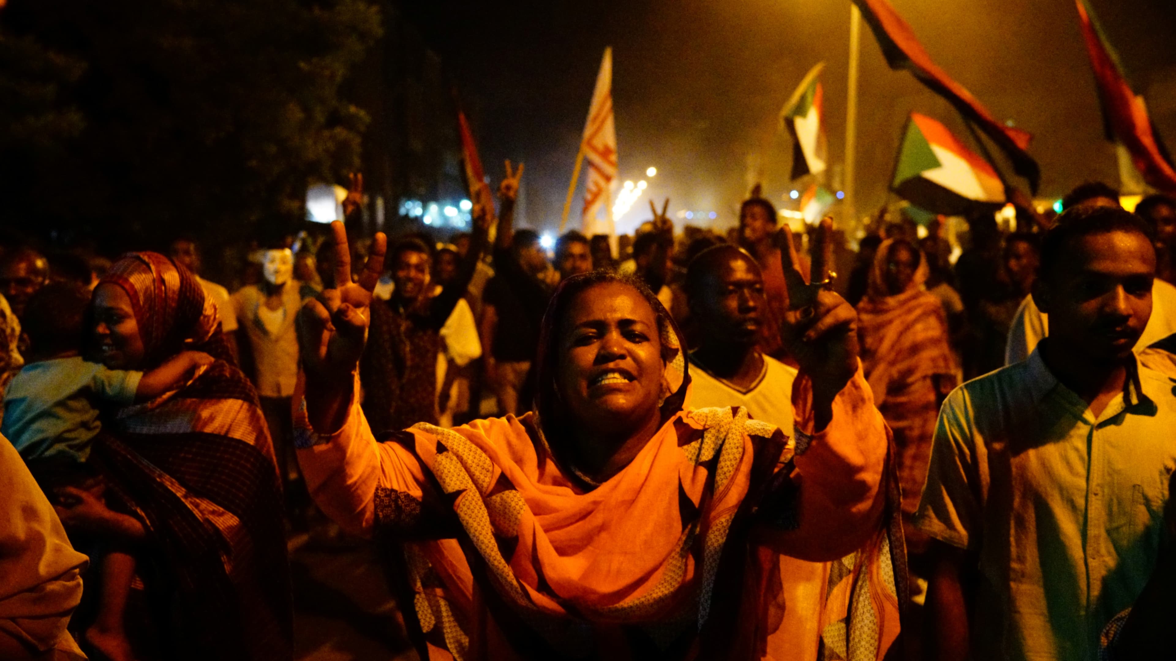 Sudanese people, seeking to revive a push for civilian rule in ongoing tumult since the overthrow of former President Omar al-Bashir more than two months ago, chant slogans and wave Sudanese flags during a demonstration in Khartoum, Sudan, June 21, 2019.