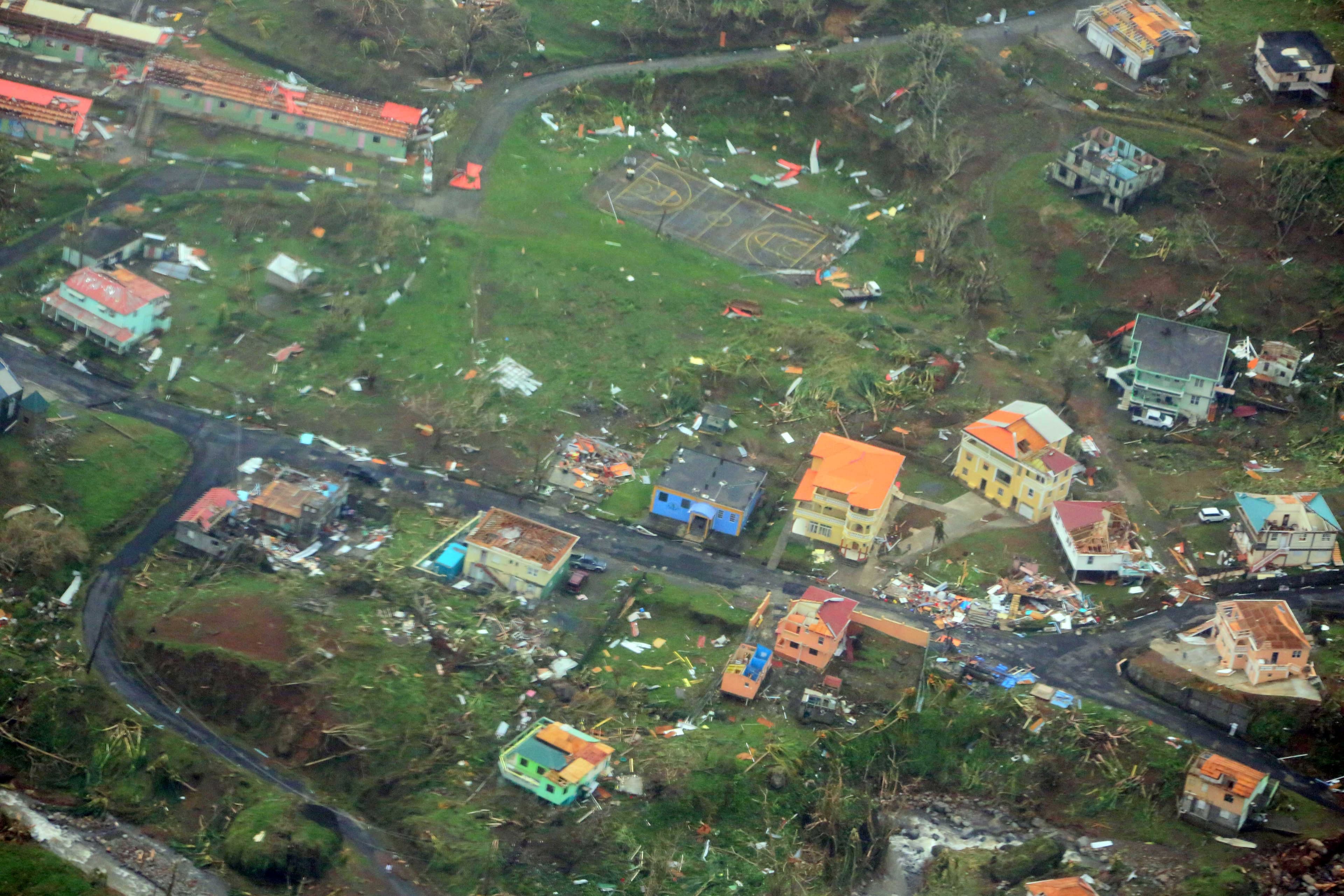 Damaged homes from Hurricane Maria are shown in this aerial photo over the island of Dominica, Sept. 19, 2017.