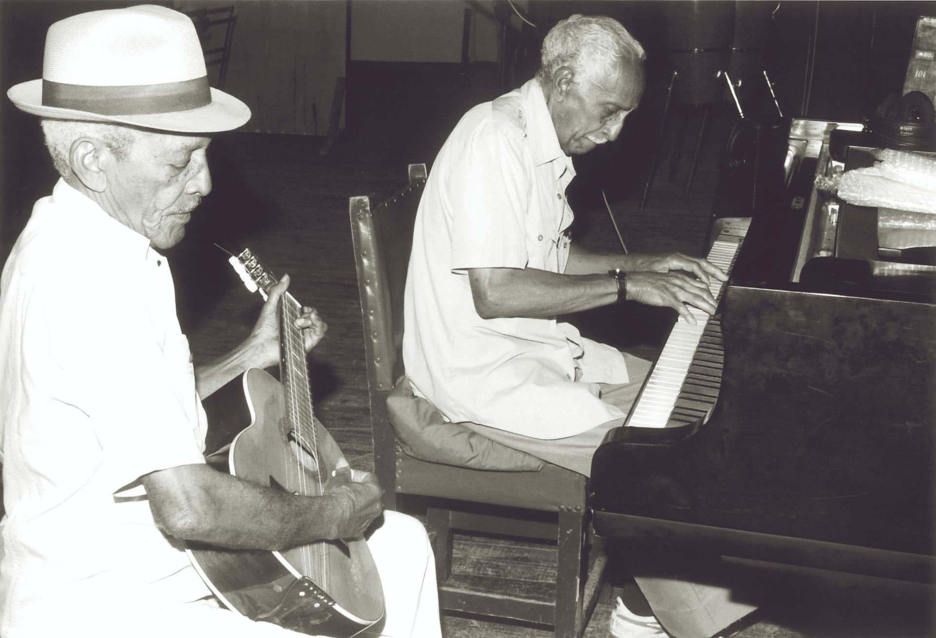 Compay Segundo and Rubén González rehearse together.