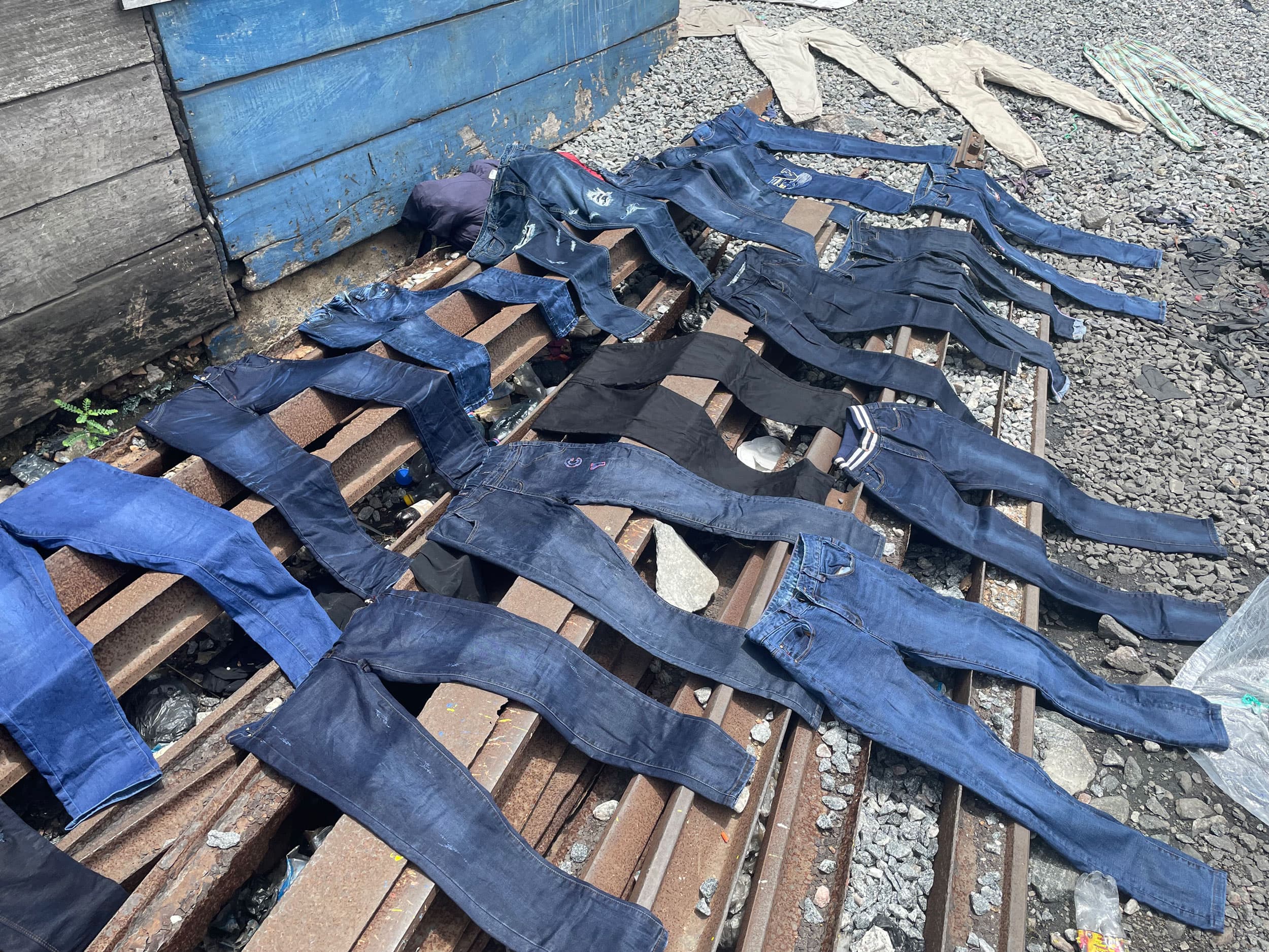 Secondhand jeans are washed and dried for resale.