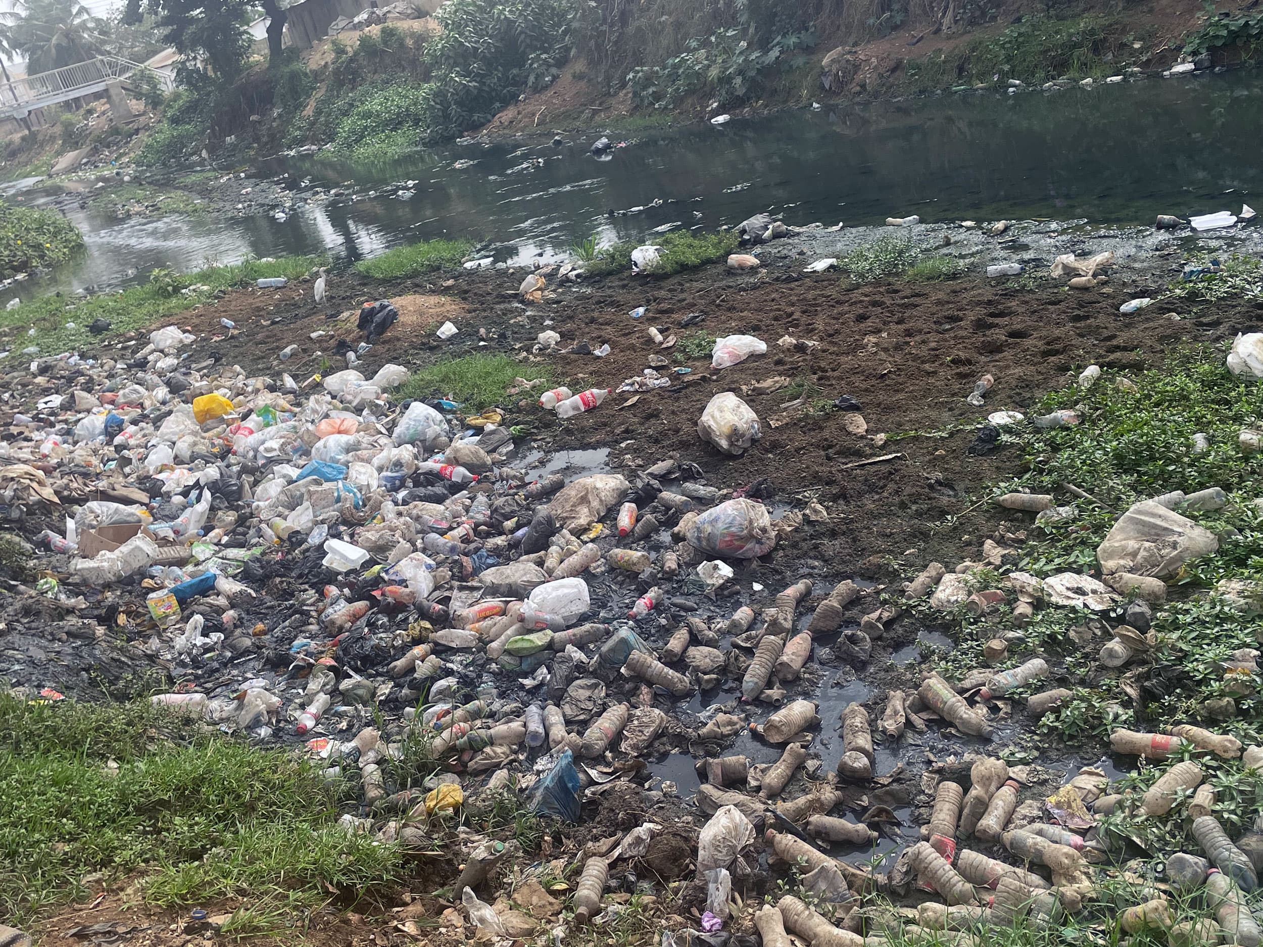 Open drains are engulfed by plastic waste in central Ghana.