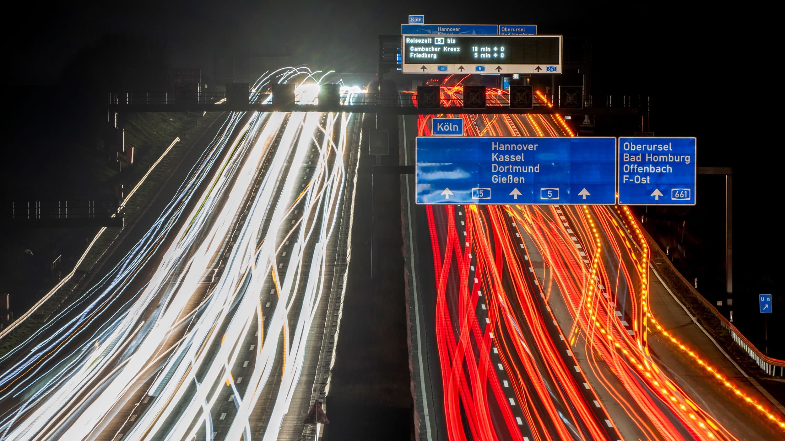 Long exposure photo shows cars and trucks driving on a highway in Frankfurt, Germany, Thursday, Feb. 24, 2022.
