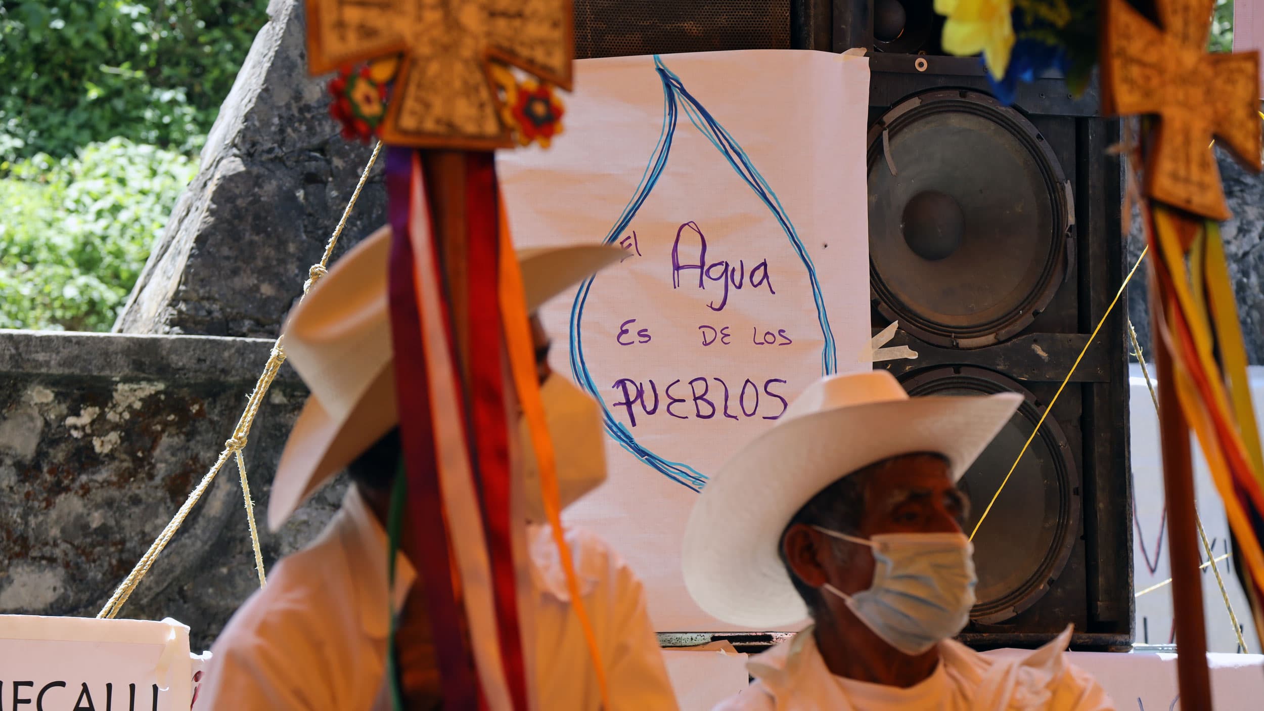 "Water is for the people" reads a sign in defense of Indigenous land and water rights at a large gathering in Ahuacatlán, Puebla state, Mexico.
