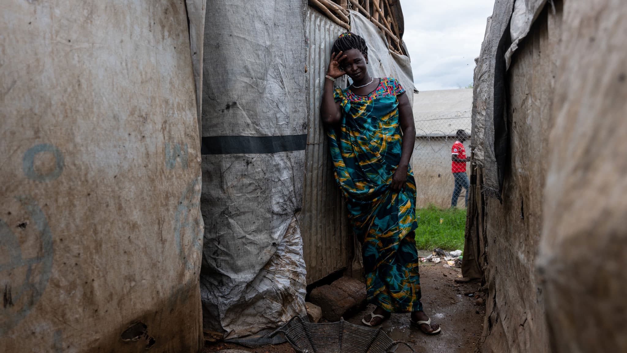 Elizabeth Thonyuak stands in front of her tent at a camp for displaced people in Juba, South Sudan.