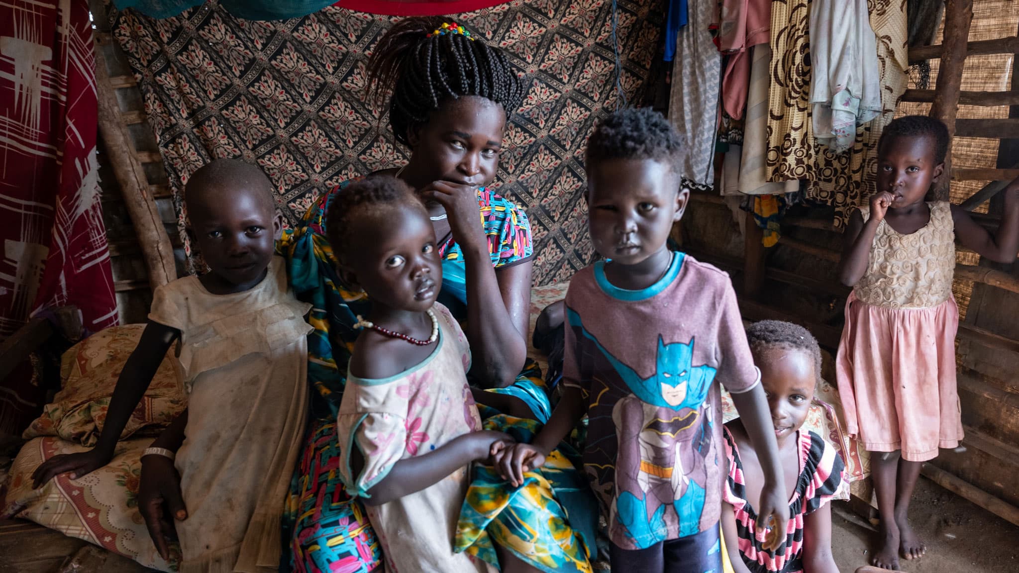 Elizabeth Thonyuar sits with her children in her tent at a camp for displaced people in Juba, South Sudan.