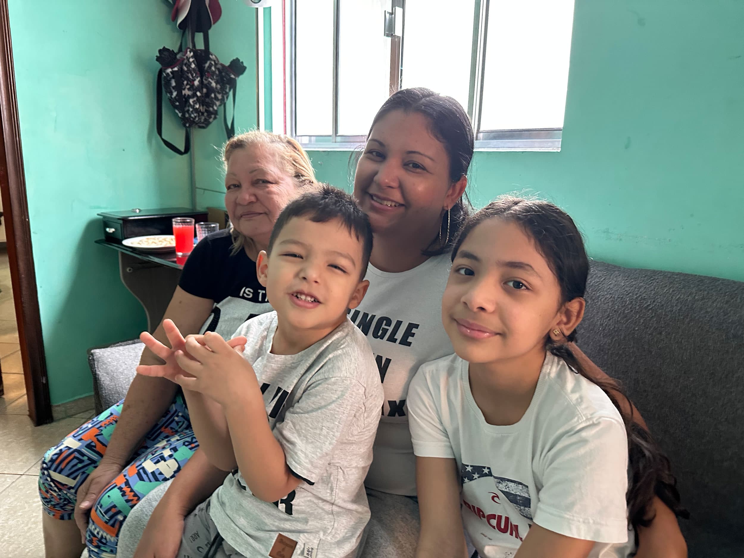 Yoselin Calcurian (center) with her youngest son Josué, 4, and daughter Sofia, 9. Her mother (left) was visiting them from Venezuela.