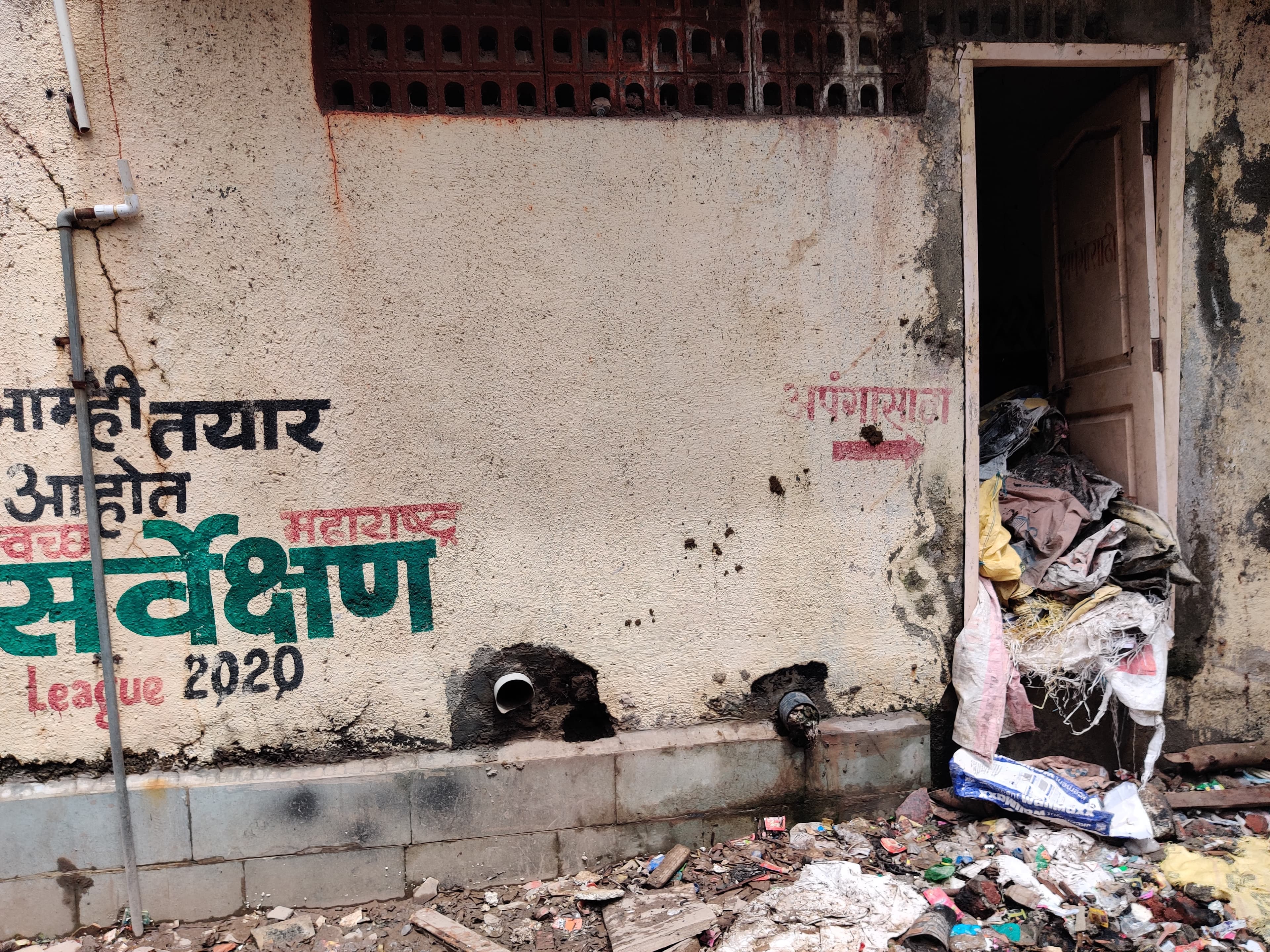 An unkept building with graffiti on its outside