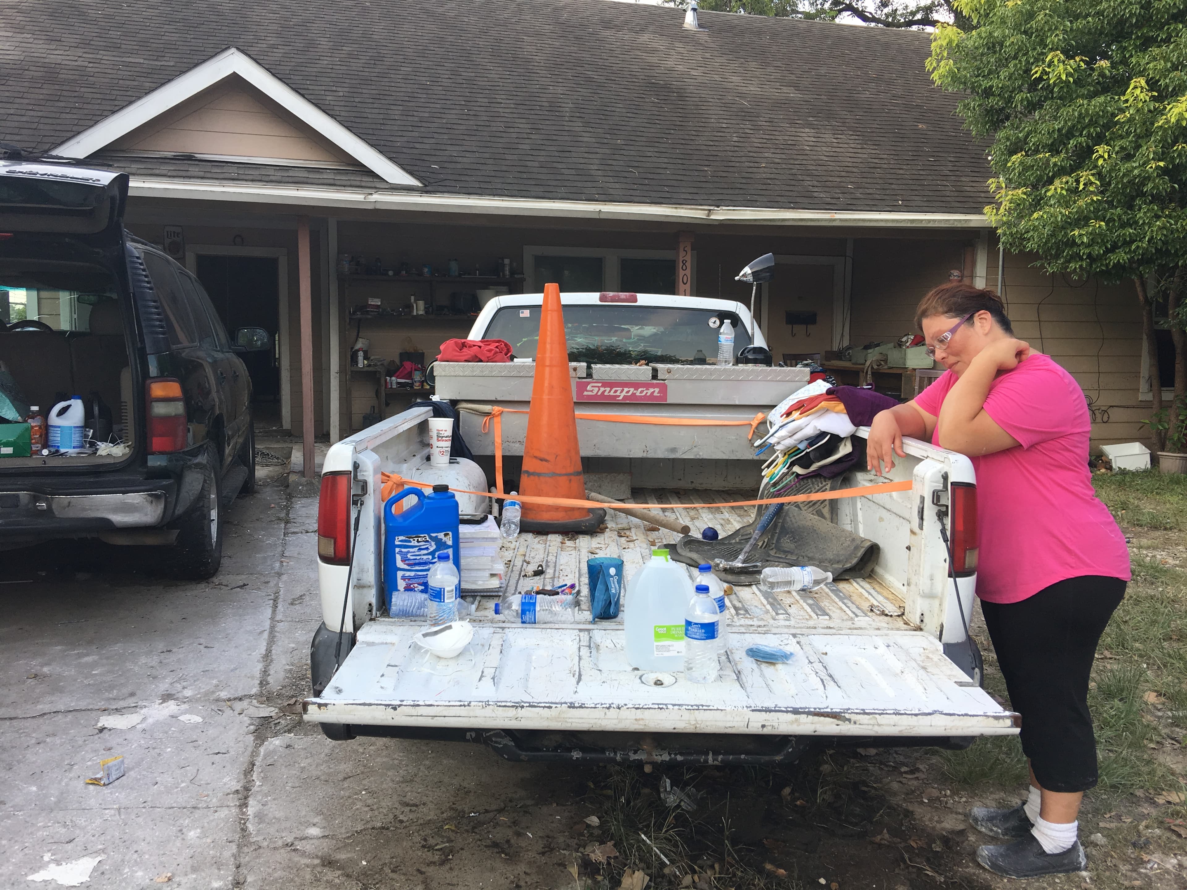 Sonia Saldaña in front of her home in Houston's Kashmere Gardens neighborhood, hit hard by Hurricane Harvey.